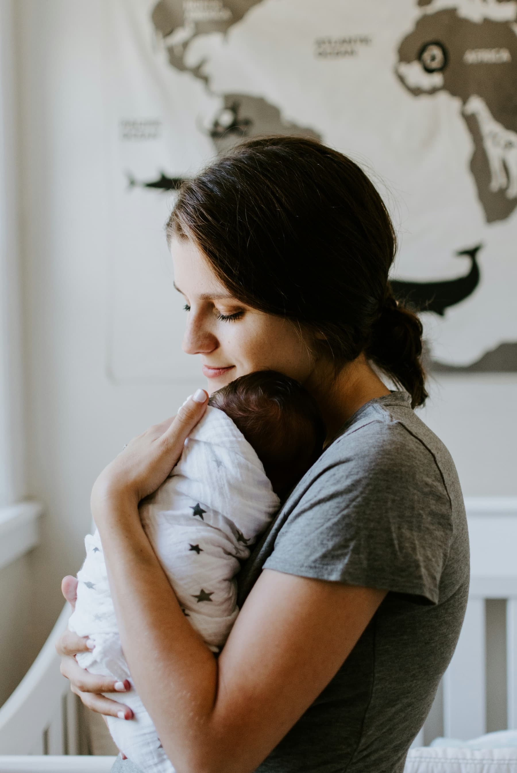 A mother tenderly holding her baby